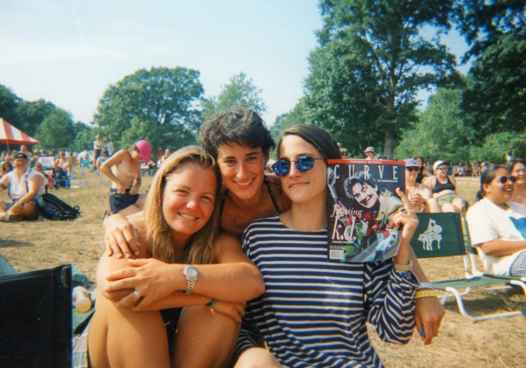 three woman take a photo together