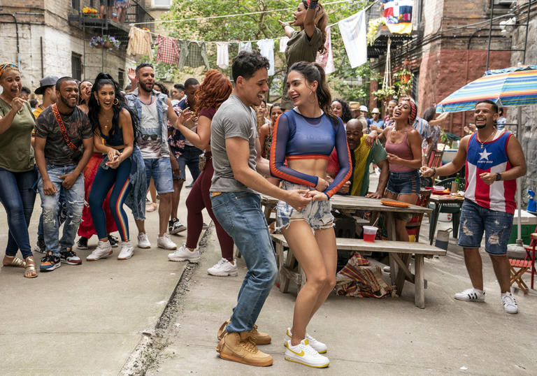 people dancing and smiling in the street