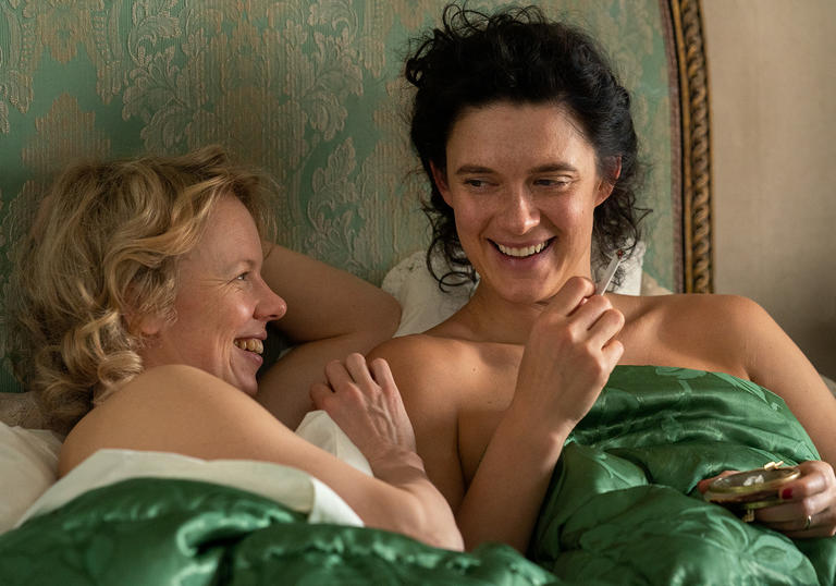 Alma Pöysti as Moomin's creator, in bed and laughing with Krista Kosonen as Vivica Bandler, in the biopic Tove