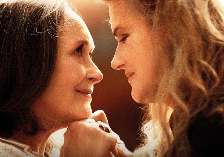 Barbara Sukowa and Martine Chevallier look lovingly into each other's eyes in a still from the film Two of Us