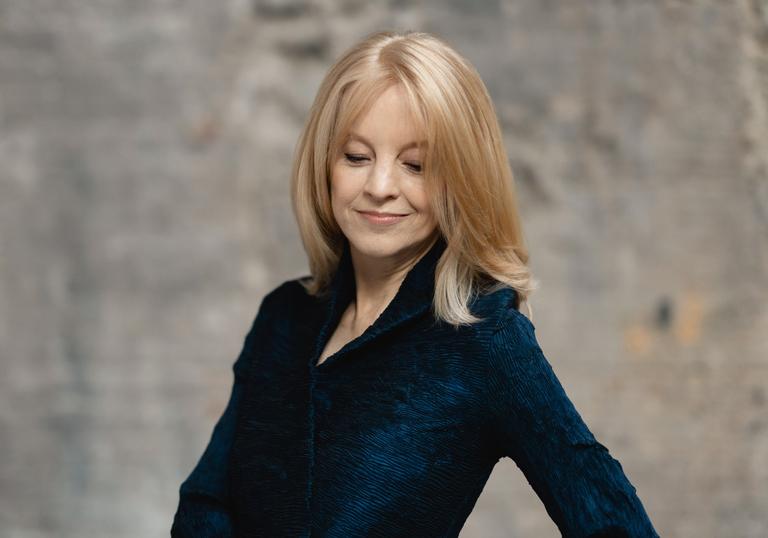 colour photo of Maria Schneider wearing a black jacket