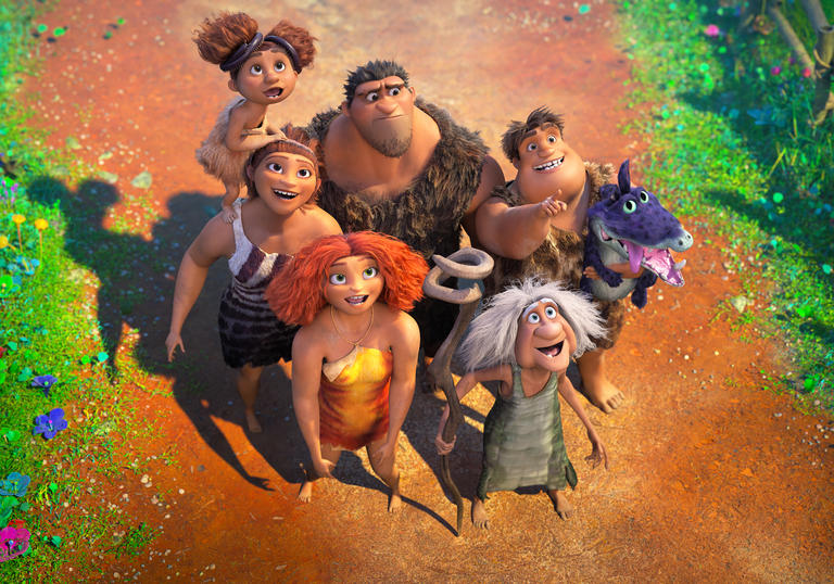 the croods stand together on a path looking up at the sky