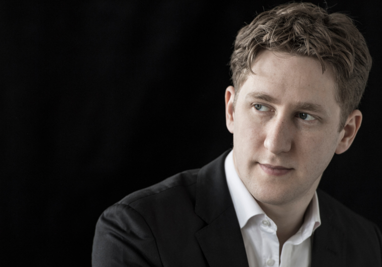 Image of conductor, Joshua Weilerstein