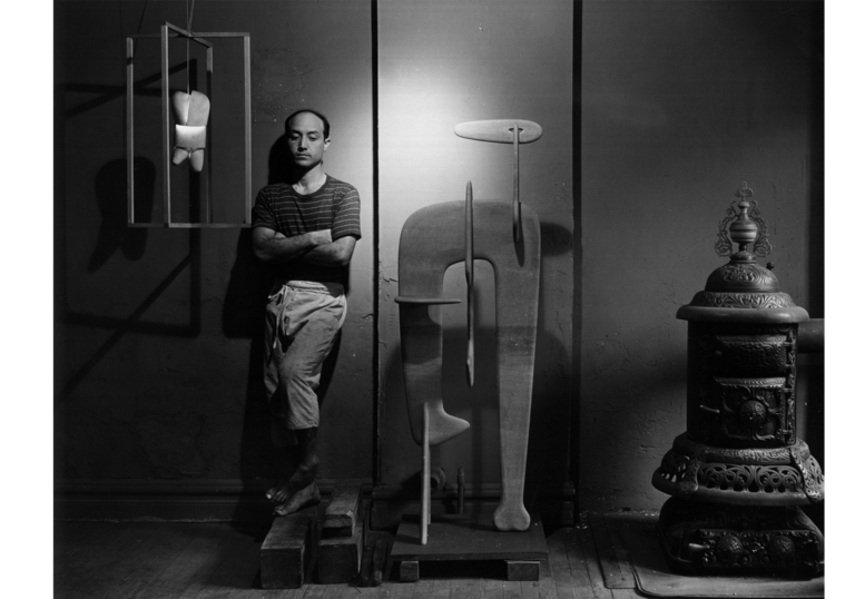 Isamu Noguchi in his studio