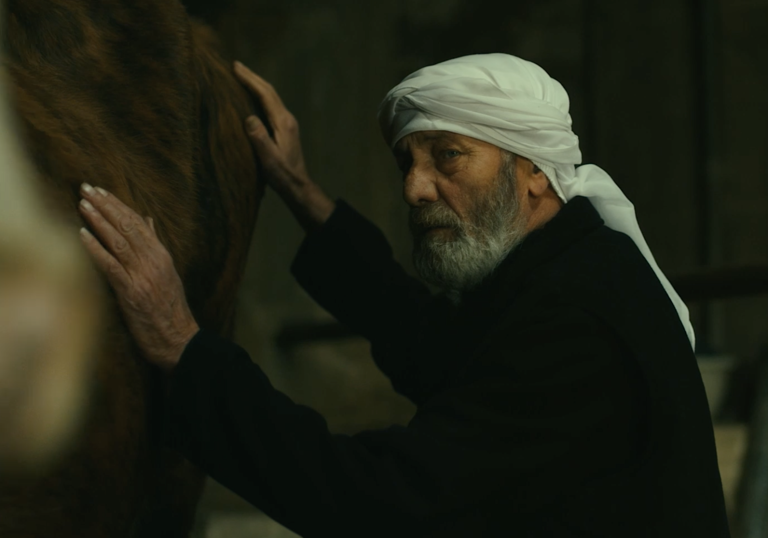 Still from The Stranger/Al Garib of man with horse