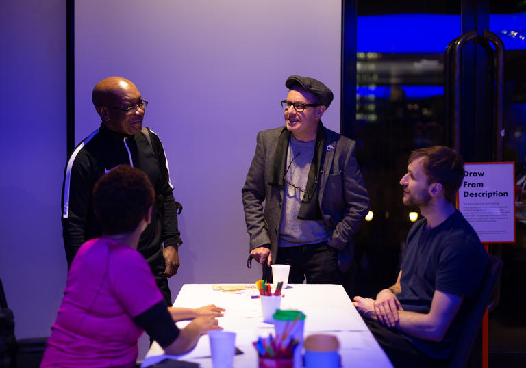 Group of participants at a workshop around a table