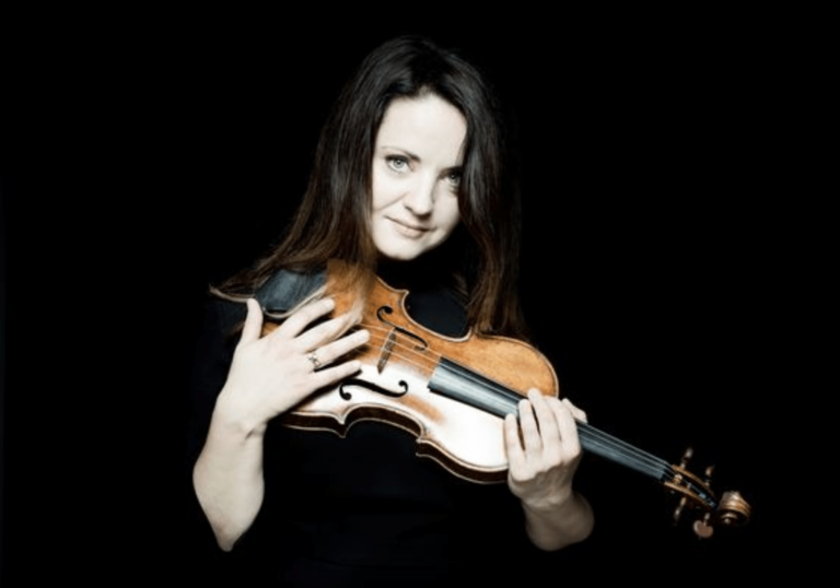 Baiba Skride holding a violin.