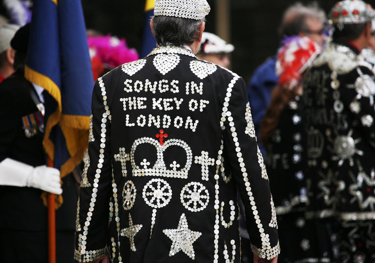 A photo of a pearly King, the back of his jacket reads 'Songs in the Key of London'
