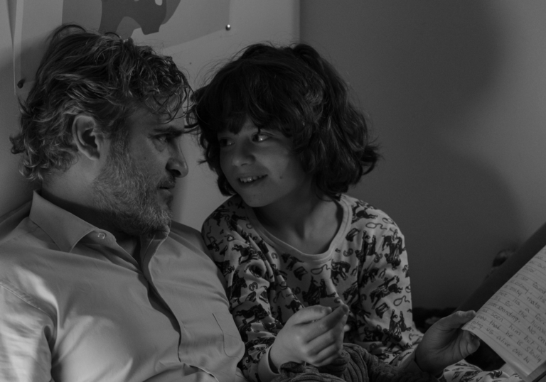 Black and white image of Joaquin Phoenix and Woody Norman