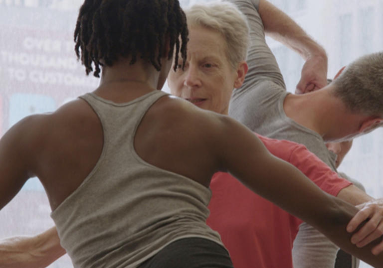 An image of free dancers, in a row one after each other directly infront of the camera with different hand and arms positions