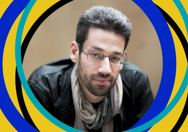 Pianist Jonathan Biss is in the centre of the frame, with BBC Symphony Orchestra branding around the edge of the image