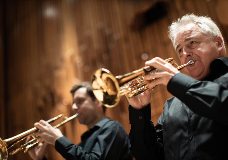 Trumpeters from Britten Sinfonia playing their instruments