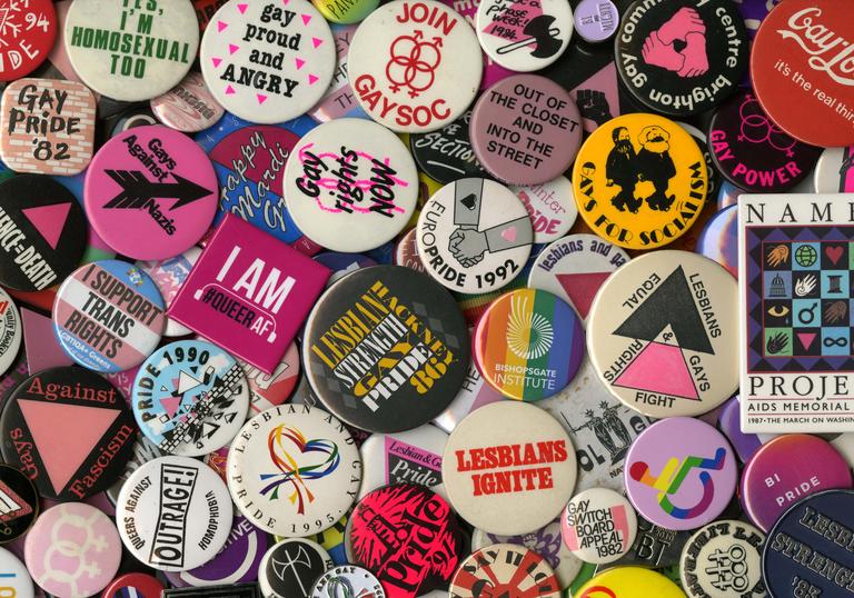 A collection of badges in lots of different colours
