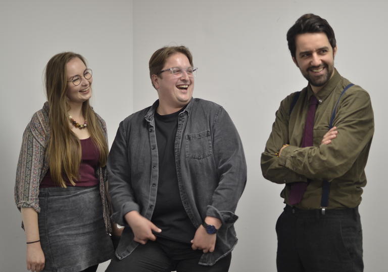 Composers Aileen Sweeney, Jonathan Brigg and Nathan James Dearden standind together laughing