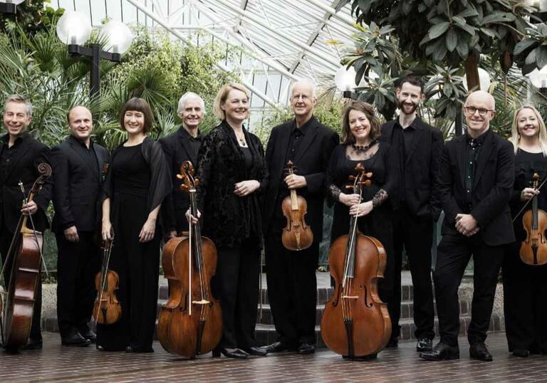 Musicians from the Academy of Ancient Music holding their instruments