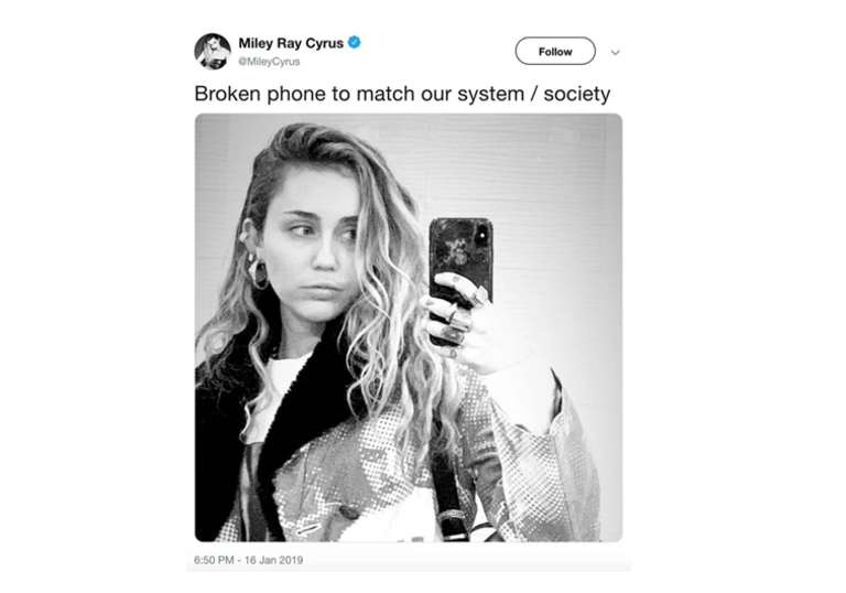 Tweet of Miley Cyrus holding a broken phone