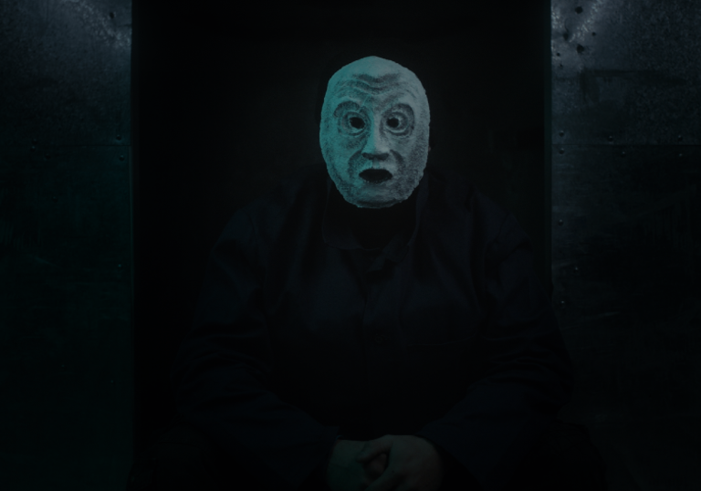 Dark image of a masked man