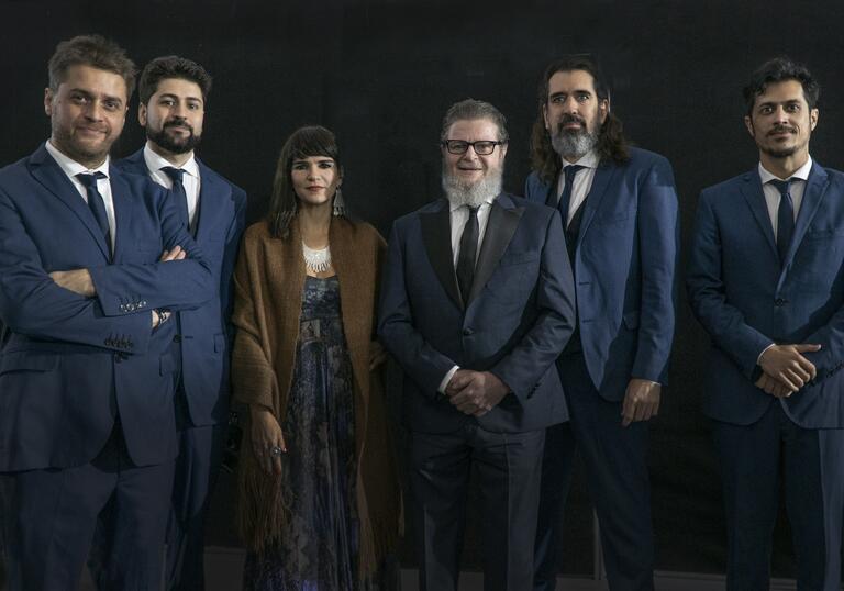 A portrait of Gustvao Santaolalla and his band