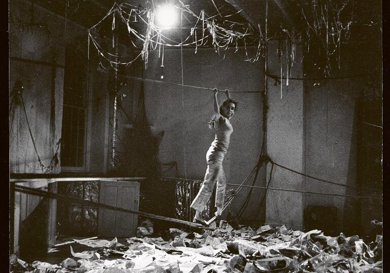 black and white photo of Carolee Schneemann performing Water Light / Water Needle