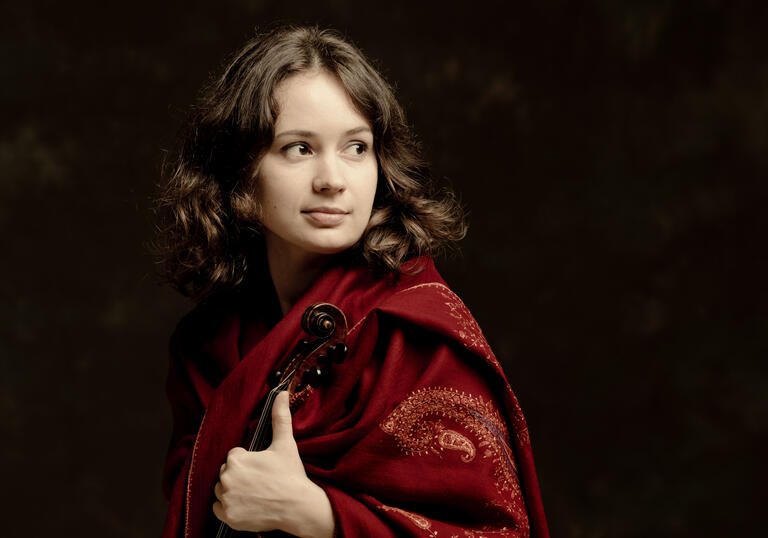 Patricia Kopatchinskaja holding a violin