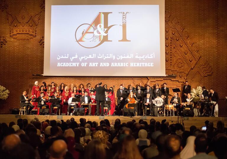 The Academy of Art and Arabic Heritage Choir performing on stage