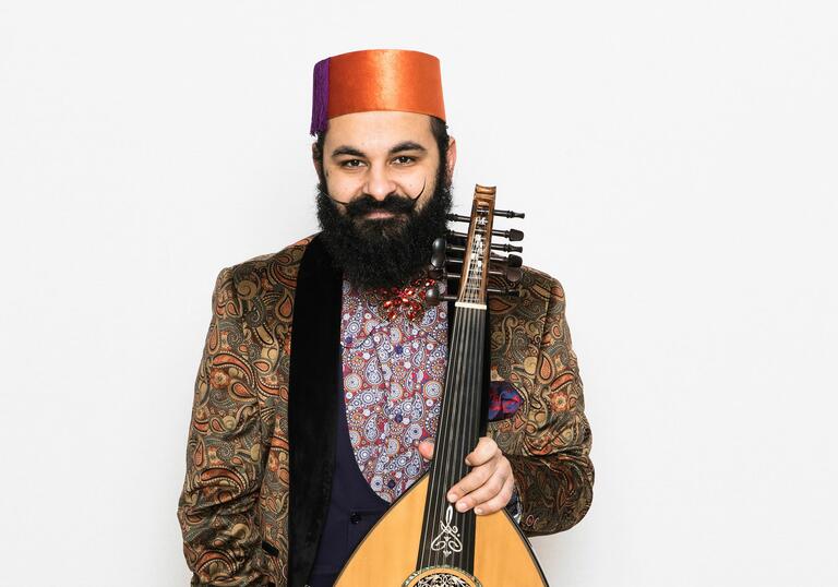 Joseph Tawadros holding his oud