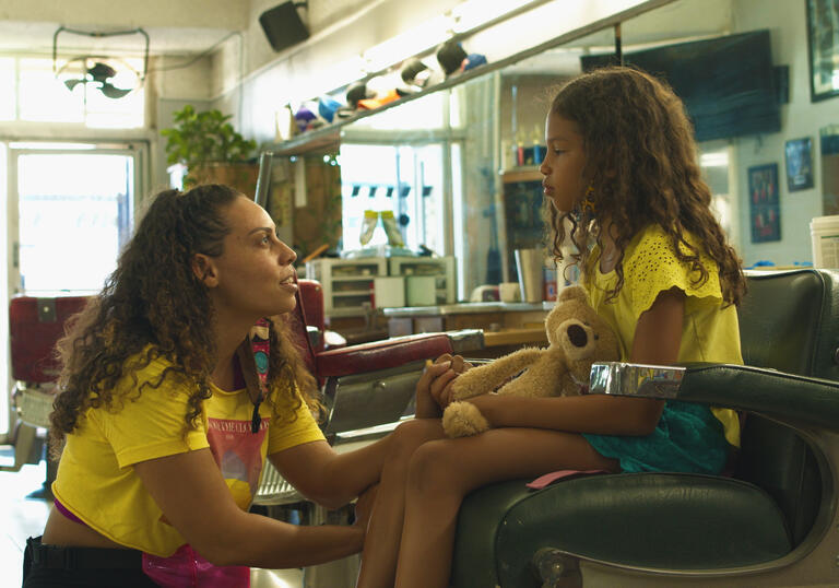 A woman talks to her young daughter, still from I'm Fine (Thanks For Asking)