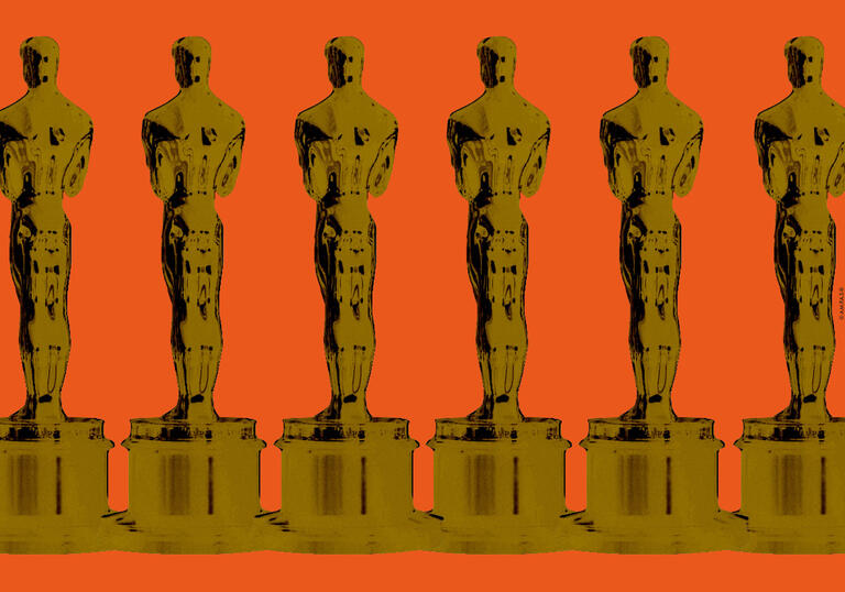 The iconic Oscar statuette side-by-side