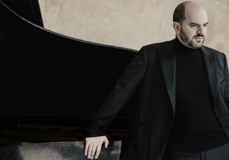 Kirill Gerstein next to piano