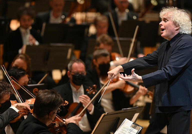 Sir Simon Rattle conducting