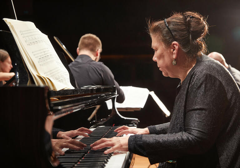 Close up on pianist of chamber ensemble