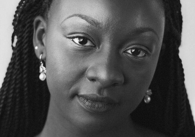 Black and white headshot of Temi Oh