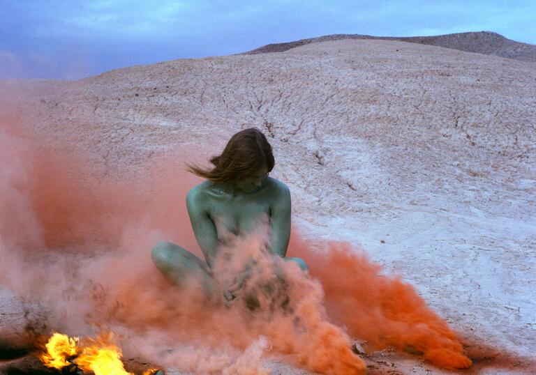 Judy Chicago, Immolation from Women and Smoke, 1972 Fireworks performance Performed by Faith Wilding in the California Desert © Judy Chicago/Artists Rights Society (ARS), New York Photo courtesy of Through the Flower Archives Courtesy of the artist; Salon 94, New York; and Jessica Silverman Gallery, San Francisco