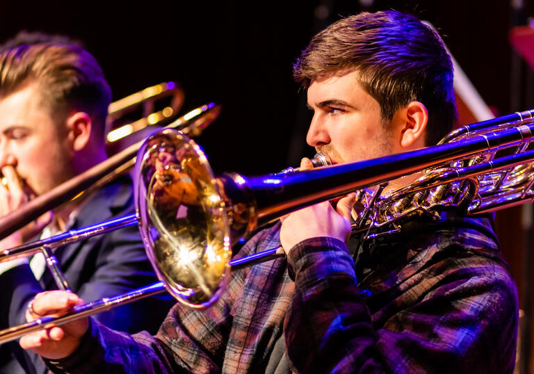 Two Guildhall School jazz trombone players in performance