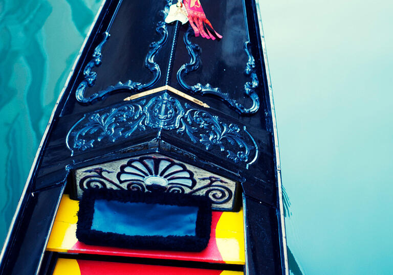 Close up photo of a gondola on the water