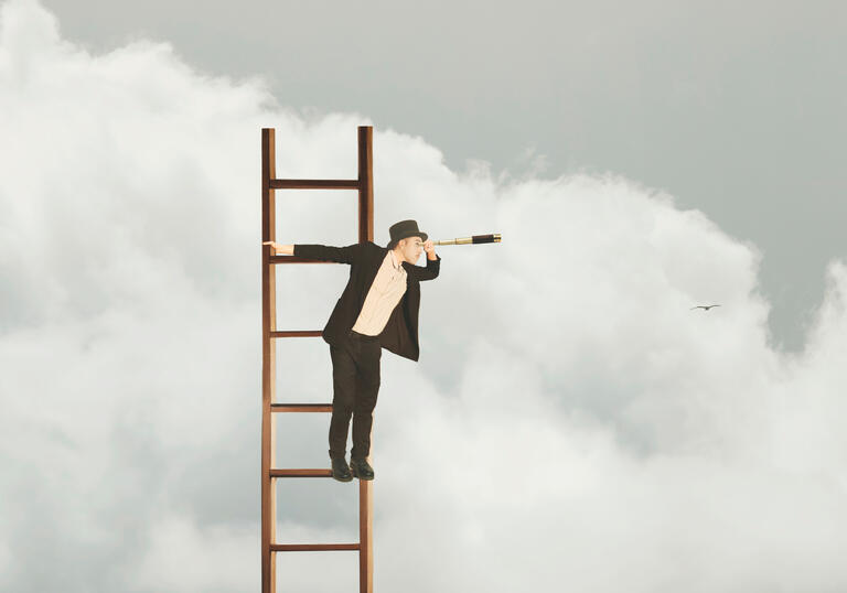 Person dressed in black suit and white shirt at the top of a ladder looking through a telescope, with clouds in the background