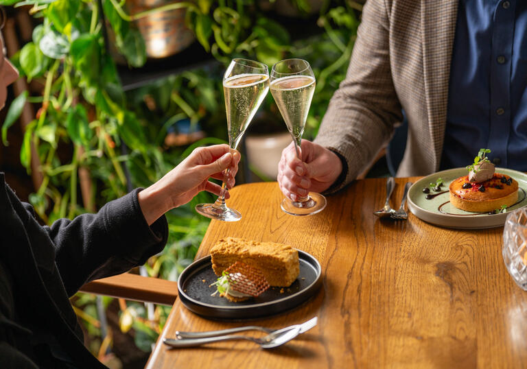 Clicking champagne glasses in Barbican Brasserie