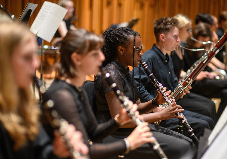 Musicians from the wind section of the LSSO, with clarinets in the foreground and bassoons in the background.