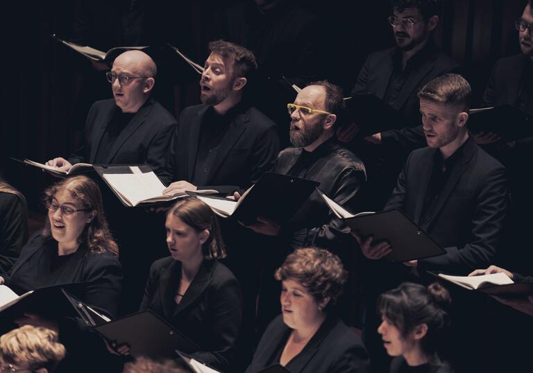 Members of the Fourth Choir singing on stage