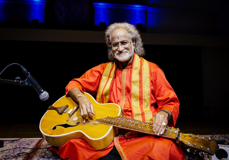 Photo of Vishwa Mohan Bhatt playing the Mohan veena