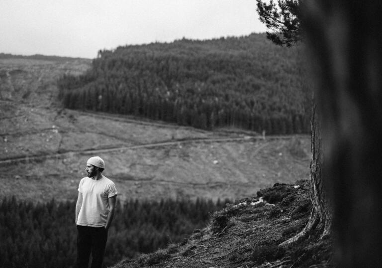 James Vincent McMorrow standing in front of a field