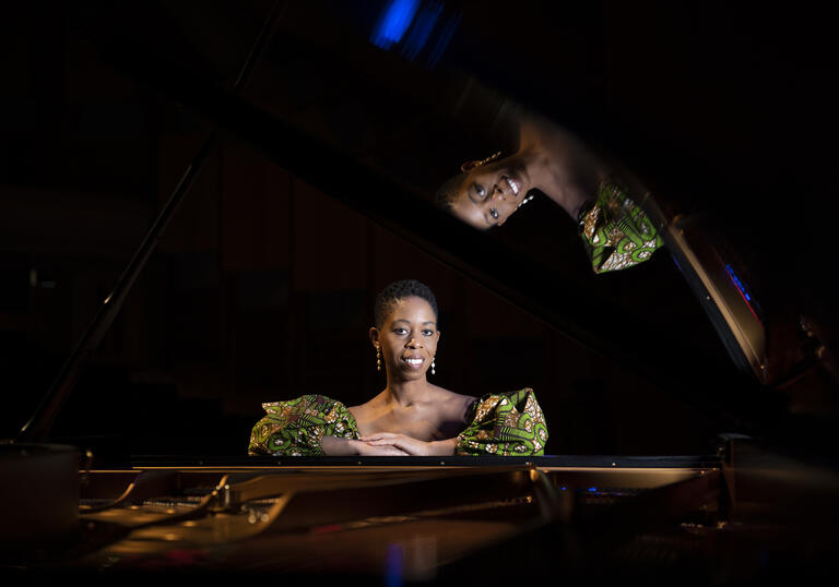 Samantha Ege sat in front of a grand piano