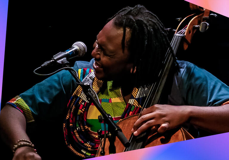 Abel Selaocoe playing his cello against a black background, with purple and pink triangular shapes framing the photo