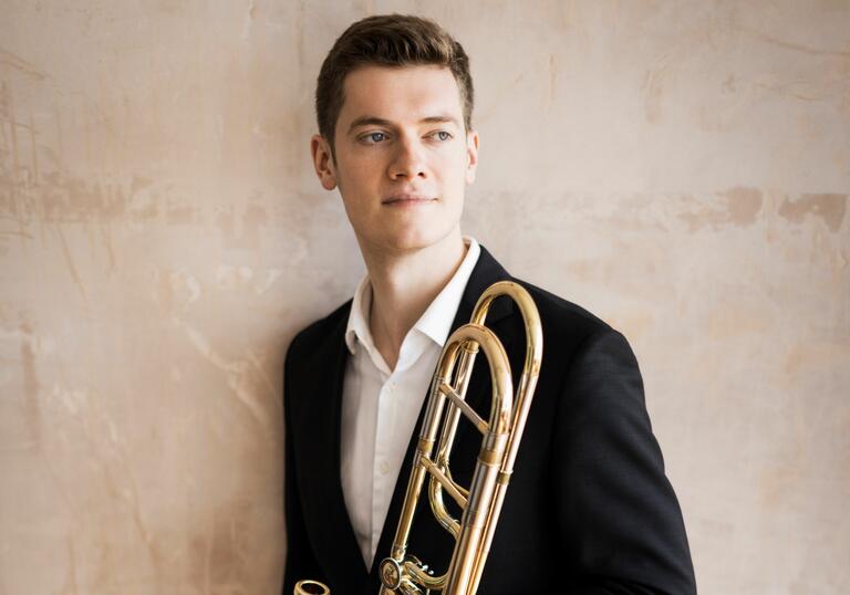 Peter Moore holding his trombone