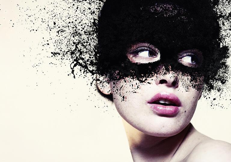 A person wearing a black mask