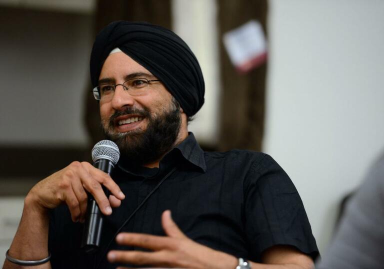 Arvind Pal Singh Mandair talking into a microphone