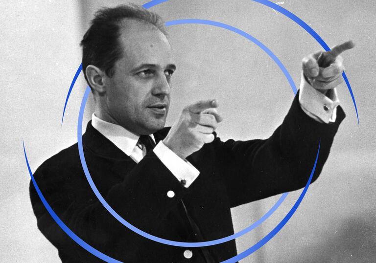 A black and white photo of Boulez pointing with both fingers. There are blue circular swirls around him.