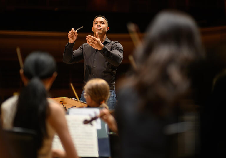 Matthew Lynch conducting the LSSO in the Barbican Hall