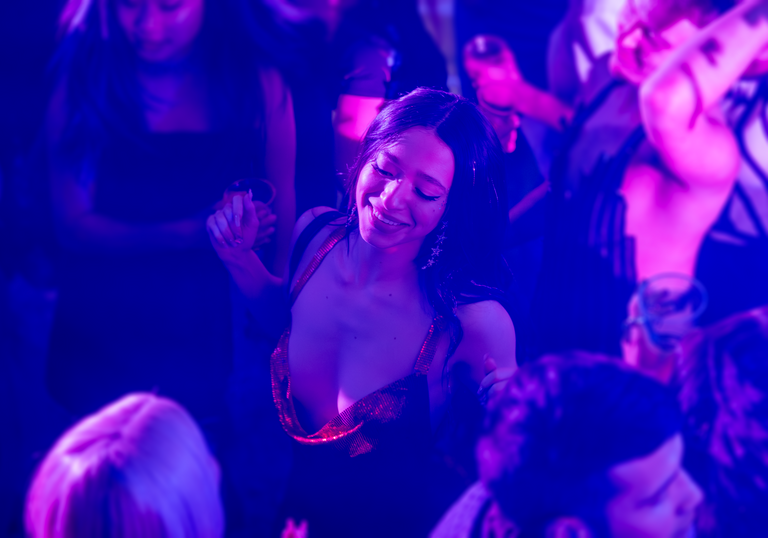 A woman dances on a dancefloor