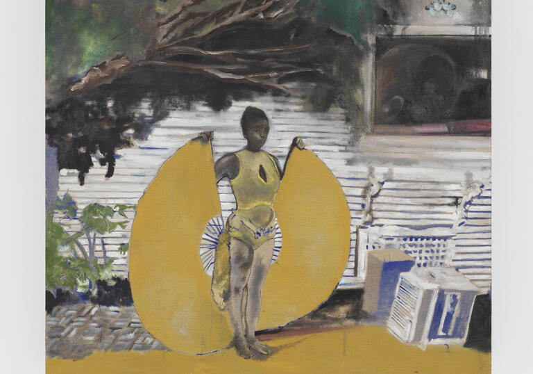 A painting of Davis's wife Karon, holding two golden wings at her sides, reminiscent of a winged goddess. She is in front of the grey wooden wall of the house, and the branches of tree looming over her. By her side there's a box and an old appliance.